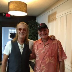 Foghat founding member Roger Earl (left) with Mark Stewart at location sponsor Big Room Bar/CD102.5.